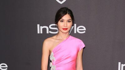 English actress Gemma Chan in a hot pink dress by Miu Miu. AFP