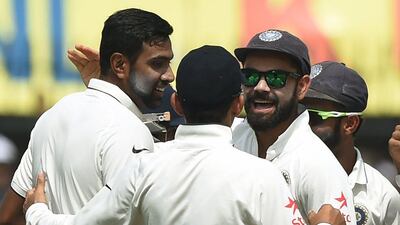 Ravichandran Ashwin, left, continues to excel against New Zealand, claiming six wickets to help India to a commanding position. Punit Paranjpe AFP