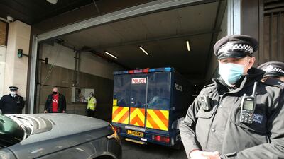 A police van carrying Wayne Couzens arrives at Westminster Magistrates' Court, in London. (Steve Parsons/PA via AP)
