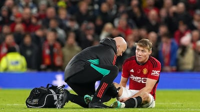 Manchester United's Rasmus Hojlund receives treatment for an injury at Old Trafford. PA