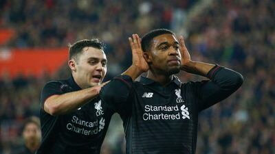 Jordon Ibe of Liverpool celebrates with Connor Randall after scoring on Wednesday in their League Cup quarter-final victory. Clive Rose / Getty Images