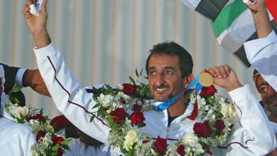 UAE's first ever Olympic gold medalists Sheikh Ahmed Mohammed Hasher al Maktoum, waves a local supporters at his arrival at Dubai from Athens, Thursday 26 August 2004. 40 years old Ahmed won gold in the Double Trap shooting discipline. EPA/Jorge Ferrari