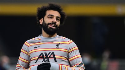 Liverpool's Egyptian forward Mohamed Salah, warming up before the UEFA Champions League match against AC Milan on December 7, 2021. AFP