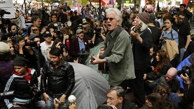 Nash and Crosby perform for demonstrators at an Occupy Wall Street protest. AFP