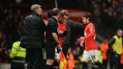 David Moyes, left, would be eager to see Shinji Kagawa back on the pitch today. Michael Regan / Getty Images