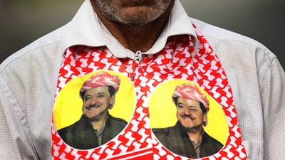 An Iraqi Kurd wears a scarf bearing a portrait of Masoud Barzani during a protest in support of the Iraqi Kurdish leader in Erbil, the capital of autonomous Iraqi Kurdistan region, on October 30, 2017. Safin Hamed / AFP