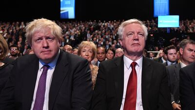 Former UK Foreign Secretary Boris Johnson and Brexit minister David Davis watch Prime Minister Theresa May speaking at the Conservative Party Conference last October. Both resigned last week sparking a crisis for Mrs May. Facundo Arrizabalaga / EPA