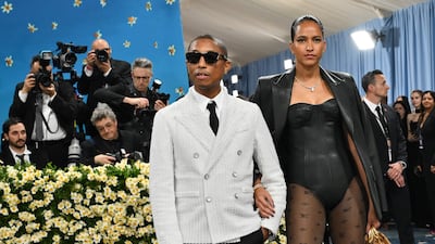 Louis Vuitton menswear creative director and gala co-chairman Pharrell Williams arrives with his wife, fashion designer Helen Lasichanh. AFP