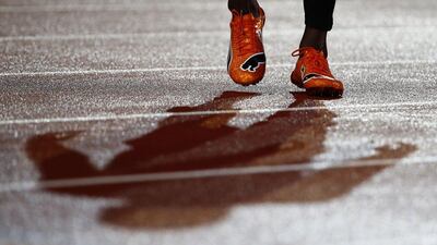 Usain Bolt's shadow and feet shown as he warmed up on Saturday for the 4x100-metre relay at the Commonwealth Games. Phil Noble / Reuters