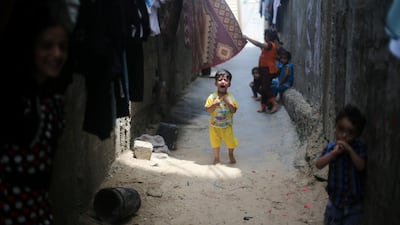 A Palestinian boy cries outside his family's house in Khan Younis refugee camp in the southern Gaza Strip, July 11, 2017. Ibraheem Abu Mustafa / Reuters