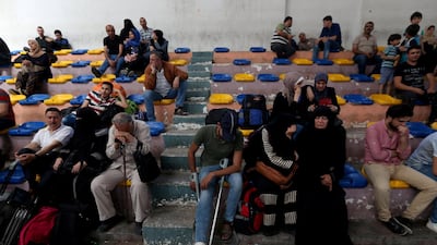 Palestinians wait to travel to Egypt from Gaza through the Rafah border crossing on May 18, 2018. Ibraheem Abu Mustafa / Reuters