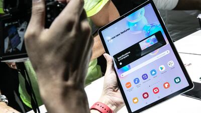 An attendee holds a Samsung Galaxy Tab S6 device. Bloomberg