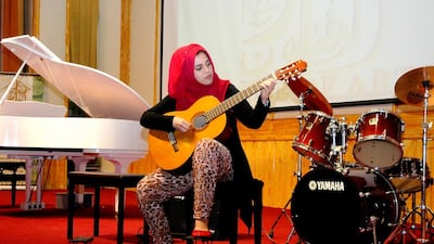 Fatima Ali Mohammad, 18, who will play the guitar at the Young Musicians Evening, says she can’t wait to show her family and friends what she has been learning beyond her university studies. Courtesy House of Arts