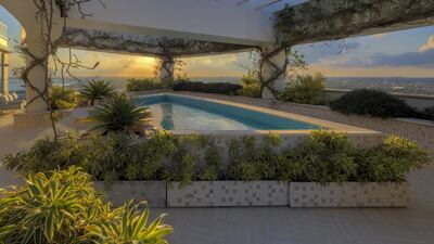 The rooftop terrace has a swimming pool and is covered with vines. Courtesy: TopTenRealEstateDeals.com and DoraPuig.com