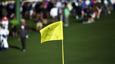A flag is pictured as patrons arrive to watch golfers during a practice round prior to the 80th Masters tournament beginning on Thursday in Augusta, Georgia. Jewel Samad / AFP / April 5, 2016
