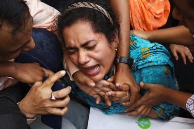 A relative of one of the victims mourns outside Dhaka Medical College Hospital. Reuters