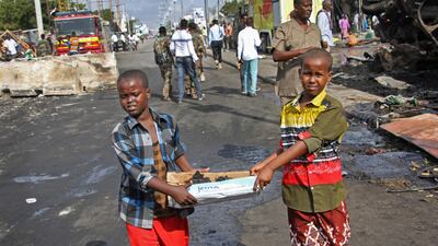 Somali children assist other civilians and security forces in rescue efforts. Farah Abdi Warsameh / AP Photo
