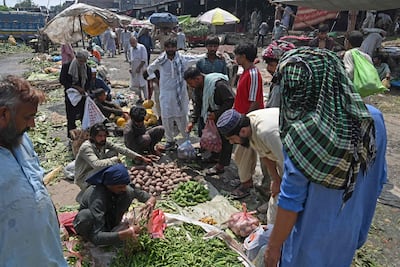 A vegetable market in Lahore. Monsoon floods have resulted in shortages that have driven up the prices of many staples. AFP