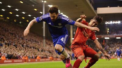 Chelsea’s Cesc Fabregas, left, in action against Liverpool’s Roberto Firmino (R) during the English Premier League soccer match between Liverpool FC and Chelsea FC at Anfield in Liverpool, Britain, 11 May 2016. EPA/PETER POWELL