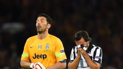 Gianluigi Buffon, left, and Andrea Pirlo of Juventus look dejected after their Uefa Champions League Final loss to Barcelona at Olympiastadion on June 6, 2015 in Berlin, Germany. (Photo by Shaun Botterill/Getty Images)