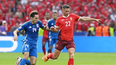 Fabian Schaer of Switzerland is challenged by Federico Chiesa of Italy. Getty Images