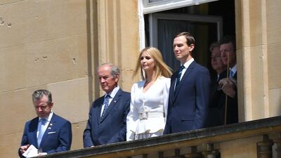 Ivanka Trump (C) and her husband Senior Advisor to the President of the United States Jared Kushner (R) watch from a balcony as the US President Donald Trump and US First Lady Melania Trump arrive for a welcome ceremony at Buckingham Palace. AFP