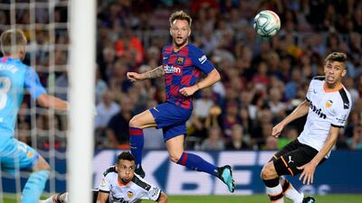 Barcelona's Croatian midfielder Ivan Rakitic eyes the ball. AFP