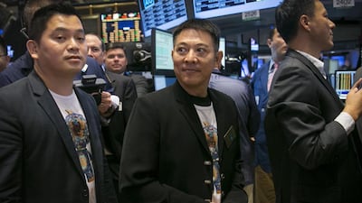 Chinese actor Jet Li, centre, attends the Alibaba initial public offering at the New York Stock Exchange. Brendan McDermid / Reuters
