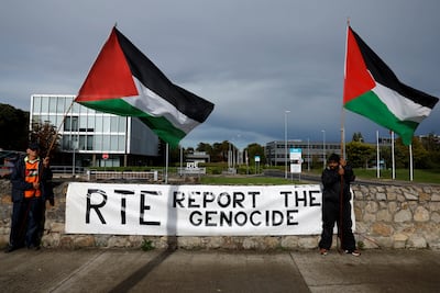 Pro-Palestinian protestors hold flags and a sign outside the RTE (Radio Telefis Eireann) Irish public service broadcaster television studios, in Dublin, Ireland. Reuters