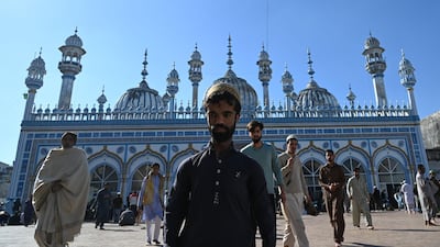 Rozi Khan leaves a mosque after Friday prayers in Rawalpindi. AFP