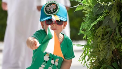 A child celebrates Ireland's National Day at the world's fair.