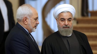Iranian President Hassan Rouhani, right, listens to his Foreign Minister Mohammad Javad Zarif prior to a meeting in Tehran, Iran, 2015. AP Photo