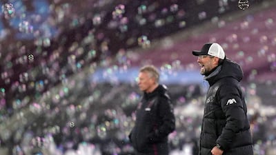 Liverpool manager Jurgen Klopp, right, and his West Ham United counterpart David Moyes. Reuters