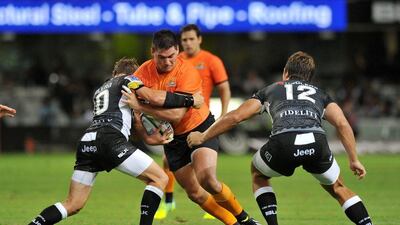 epa05196751 Felipe Arregui of the Jaguares tackled by Joe Pietersen (l) and Andre Esterhuizen (r) of the Sharks during the 2016 Super Rugby match between the Sharks and the Jaguares in Durban, South Africa, 05 March 2016. EPA/MUZI NTOMBELA UK AND IRELAND OUT