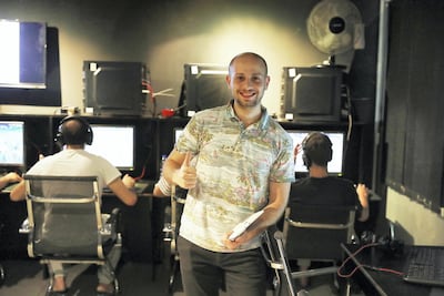 Ahmed Hamad, owner of the Booth Cafe in Khalidiya, plans to expand from 35 to 50 computers to keep up with demand. Pawan Singh / The National