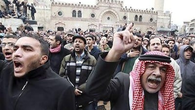 Jordanians protest against rising fuel prices in Amman on Friday.