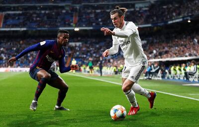 Real Madrid's Gareth Bale, right, in action with Barcelona's Nelson Semedo. Reuters