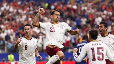 Spain's Mikel Oyarzabal celebrates scoring from the spot. AFP