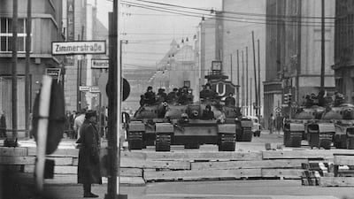 1961 - Tanks approaching a checkpoint area of the Berlin Wall. Built by the East German government, the Berlin Wall divided East and West Berlin from 1961 until 1989. Germany will mark 20 years since the fall of the Berlin Wall this year with an internati???