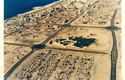 This aerial view of Abu Dhabi was taken in 1974. New buildings are rising but Qasr Al Hosn is still prominent. Courtesy: Ron McCulloch
