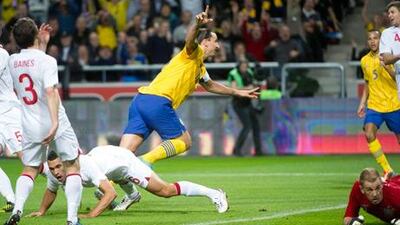 Sweden captain Zlatan Ibrahimovic scores against England during their friendly.