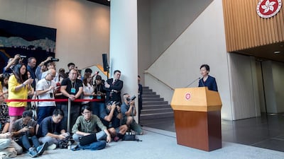 Carrie Lam, Hong Kong's chief executive, right, speaks during a news conference in Hong Kong, China. She pledged to "right away" establish a platform for dialogue with the government’s critics after more than two months of protests. Bloomberg