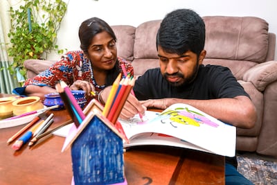 Poornima Raghav and her son Abhishek spend time together colouring, watching films and doing yoga at home. Victor Besa / The National