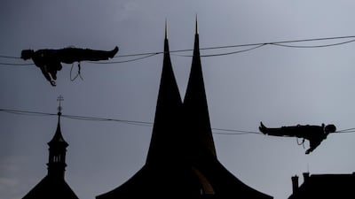 People balance on a slackline over the Emmaus Monastery in Prague, Czech Republic. EPA