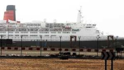 The Queen Elizabeth 2 sits docked in Port Rashid yesterday, where it has been moored in Dubai since arriving in November.
