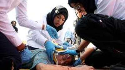 Students of Dubai Women's College taking part in an emergency response drill in Dubai yesterday.