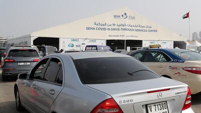 Queues at the Seha Covid-19 drive-through testing centre at Mina Rashed in Dubai. Pawan Singh / The National