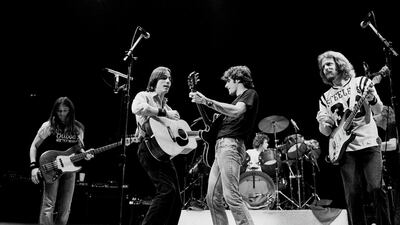 American rock group the Eagles, with special guest Jackson Browne (second left), perform onstage at the Chicago Stadium, Chicago, Illinois, October 22, 1979. Pictured are, from left, Timothy B Schmit, Jackson Browne, Glenn Frey, Don Henley (behind drums), Don Felder, and Joe Walsh. Getty Images