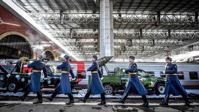 Russian honour guard soldiers march next to the train with "Syrian Breakthrough" exhibition pieces displayed. AFP