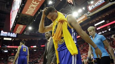 Golden State Warriors' Stephen Curry heads off the court and to the locker room at the start of the second half in Game 4 of a first-round NBA basketball playoff series against the Houston Rockets, Sunday, April 24, 2016, in Houston. Curry was injured at the end of the first half. (AP Photo/David J. Phillip)